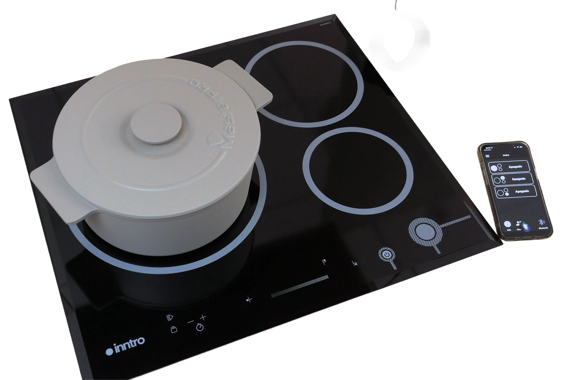 Cocina de inducción Inntro con olla y smartphone mostrando la app de control